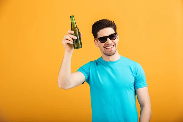 Portrait of a satisfied young man in sunglasses — Stock Photo, Image