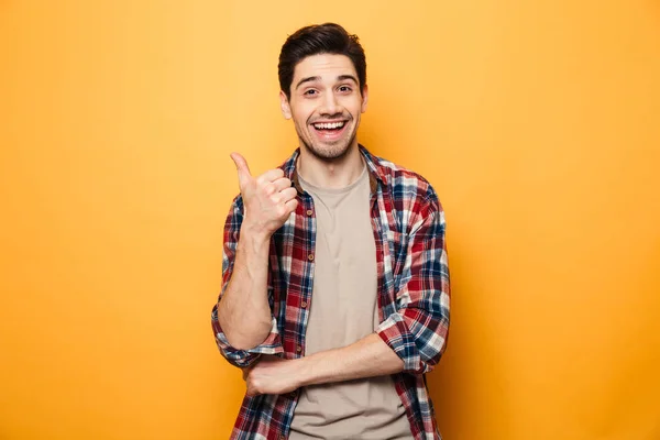 Portréja egy mosolygós fiatalember ujját el — Stock Fotó