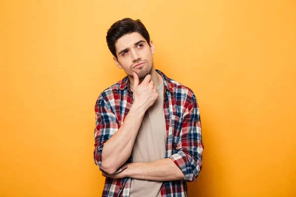 Portrait of a pensive young man looking away — Stock Photo, Image