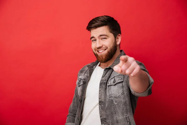 Photo of handsome cheerful man 30s in jeans jacket smiling and p — Stock Photo, Image