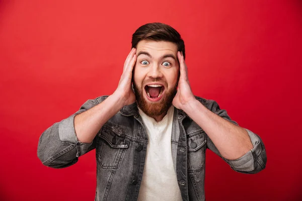 Photo of emotional guy 30s wearing beard in jeans jacket screami — Stock Photo, Image