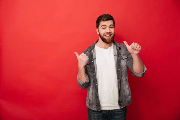 Photo of handsome man 30s in casual clothing gesturing fingers a — Stock Photo, Image