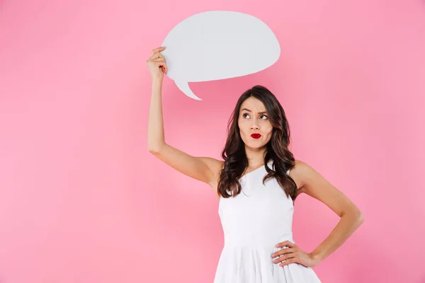 Thinking young asian woman holding speech bubble. — Stock Photo, Image