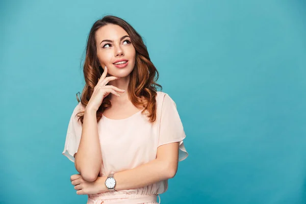 Thinking young lady standing isolated — Stock Photo, Image