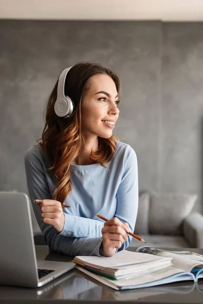 Portrait of a pretty young woman in headphones — Stock Photo, Image