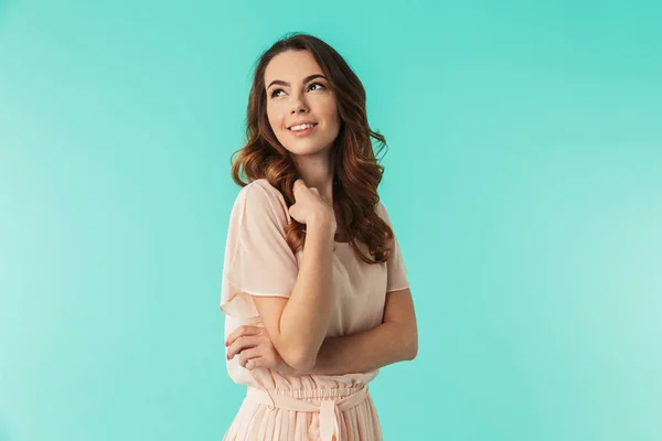 Portrait of a lovely young girl in dress standing — Stok Foto