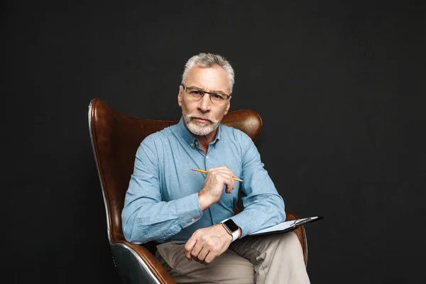 Portrait of businesslike middle aged man 50s with grey hair and — Stock Photo, Image