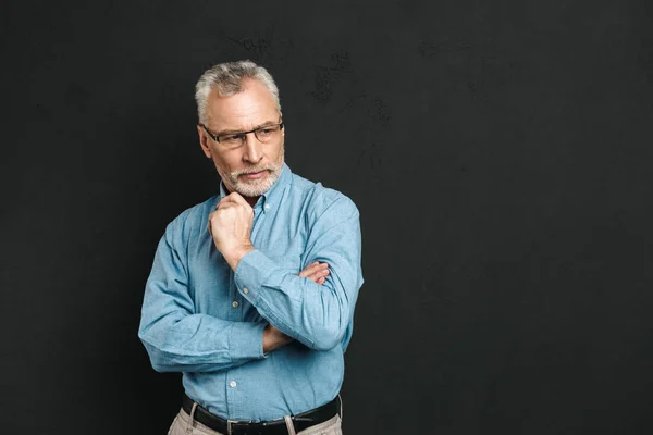 Portrait of a pensive mature man dressed in shirt — Stock Photo, Image