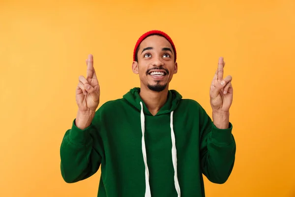 Portrait of a satisfied young afro american man in hat — Stock Photo, Image