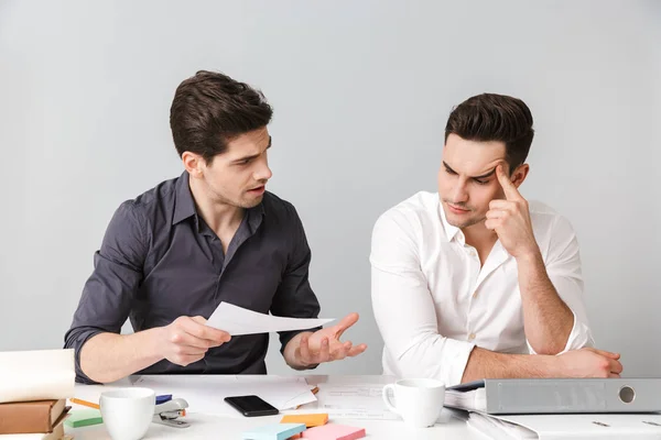 Confused young business men colleagues — Stock Photo, Image