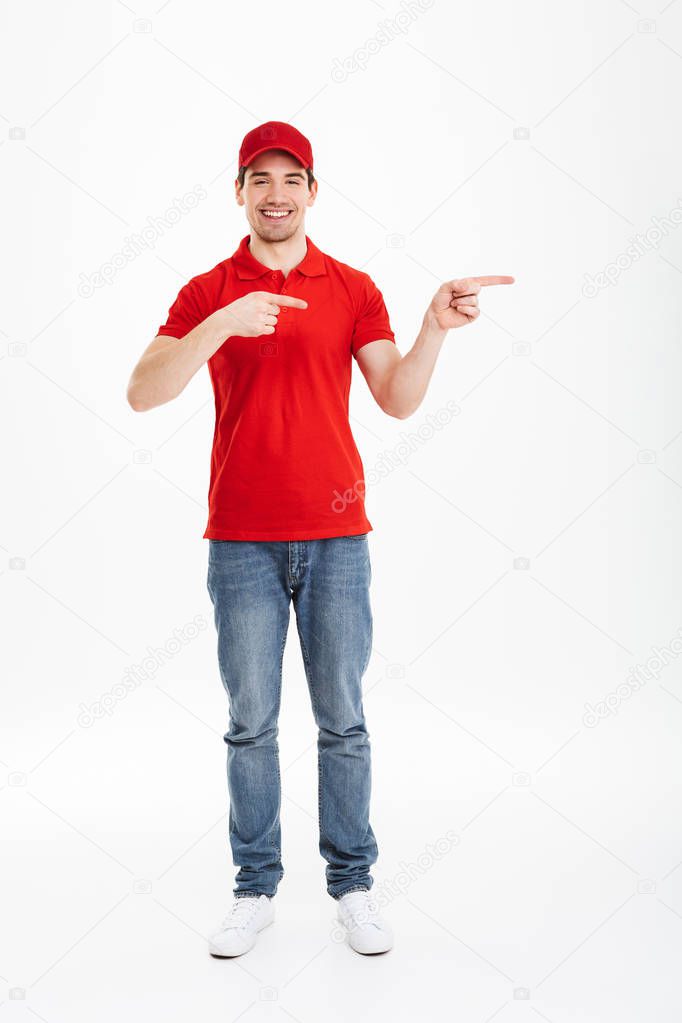 Full length photo of cheerful courier in red t-shirt and cap pre