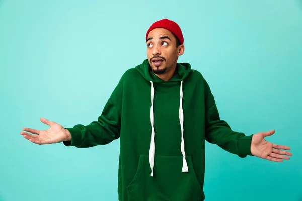 Portrait of a confused young afro american man in hat — Stock Photo, Image