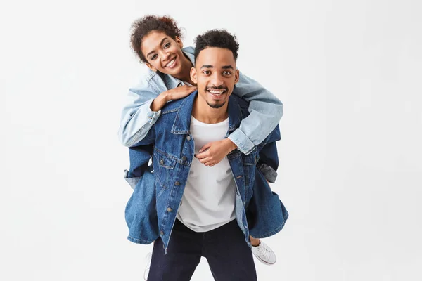 Cheerful african couple in denim shirts having fun together — Stock Photo, Image