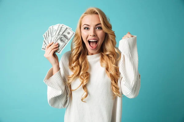 Portrait of an excited young blonde woman in sweater — Stock Photo, Image