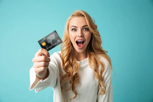 Portrait of a cheerful young blonde woman in sweater — Stock Photo, Image