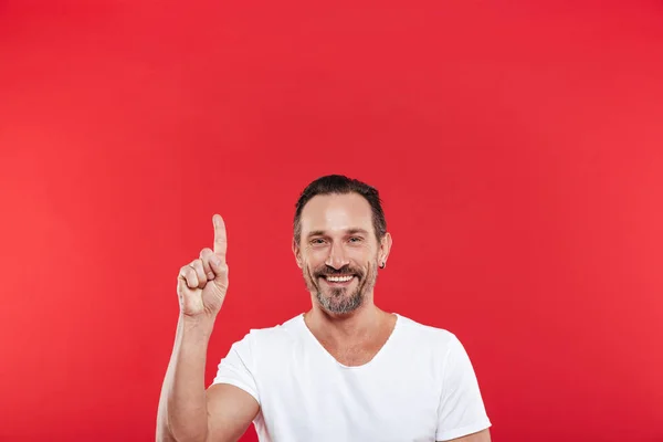 Cheerful adult man pointing. — Stock Photo, Image