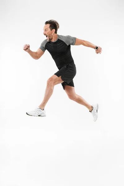Schöner ernsthafter, reifer Sportler beim Laufen — Stockfoto