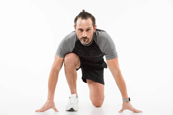 Portrait of a concentrated mature sportsman — Stock Photo, Image