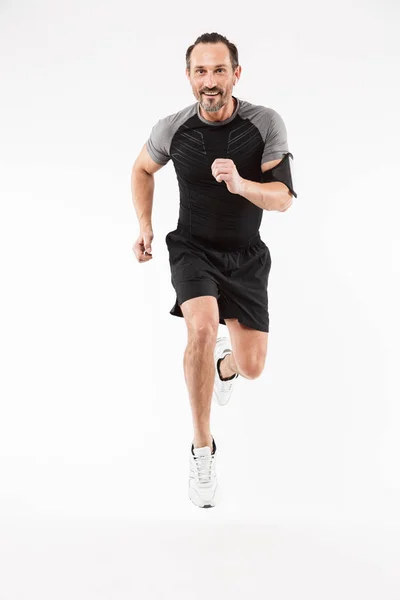 Full length portrait of a happy mature sportsman — Stock Photo, Image