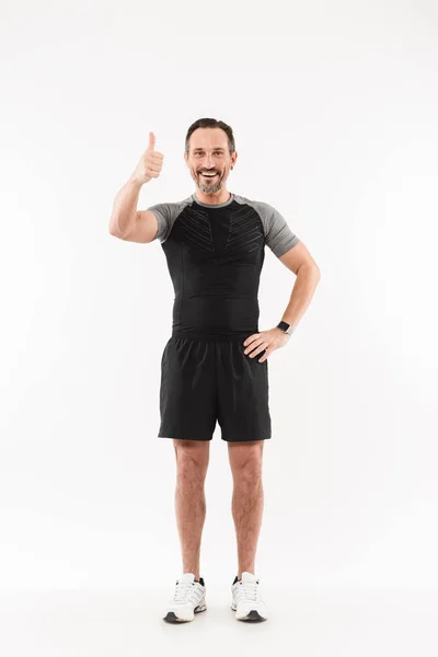 Full length portrait of a smiling mature sportsman — Stock Photo, Image