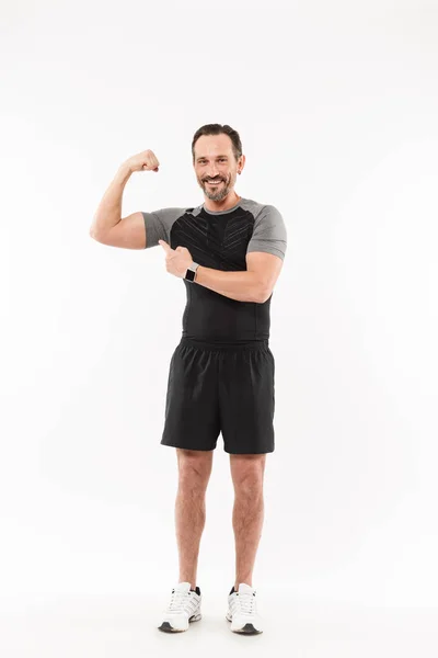 Full length portrait of a smiling mature sportsman — Stock Photo, Image