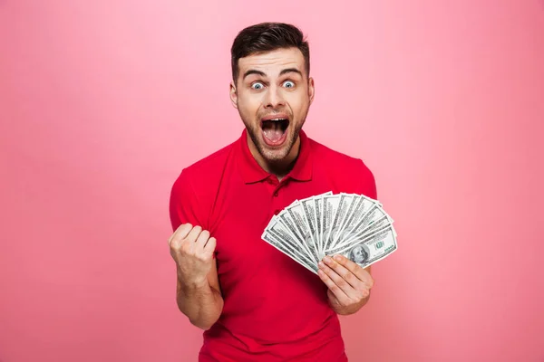 Retrato de un joven encantado con billetes de banco —  Fotos de Stock