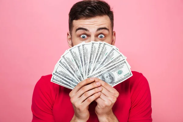 Retrato de un joven alegre con billetes de banco —  Fotos de Stock