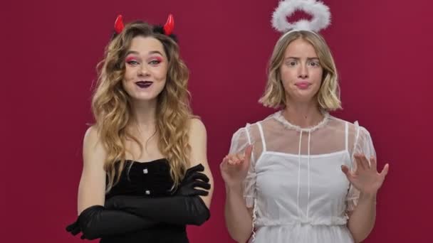 Happy Demon Girl Incites Action Sad Angel Girl Dissuades Them — Stock Video