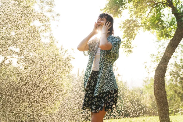 Image of happy joyful woman having fun while standing under wate — Stock Photo, Image