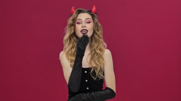 Beautiful Devil Woman Carnival Costume Blows Kiss Camera Isolated Red — Stock videók