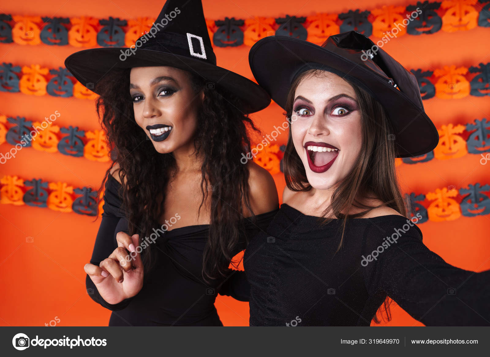 Image of pretty witch women in black halloween costume smiling t Stock Photo by