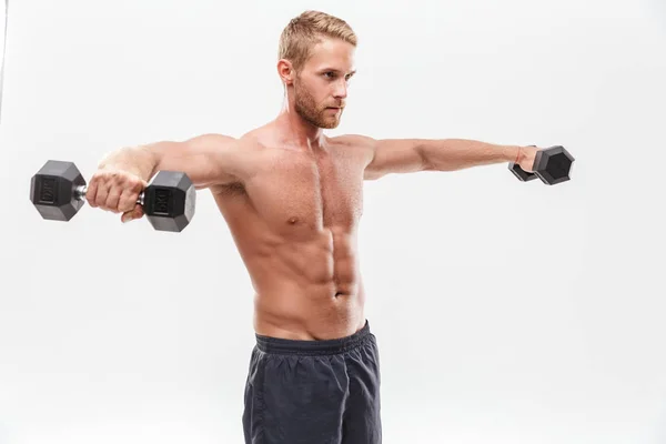 Självsäker attraktiv ung muskulös idrottsman stående — Stockfoto
