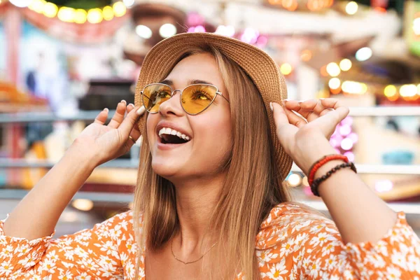 Positive cute woman walking outdoors in amusement park. — Stock Photo, Image