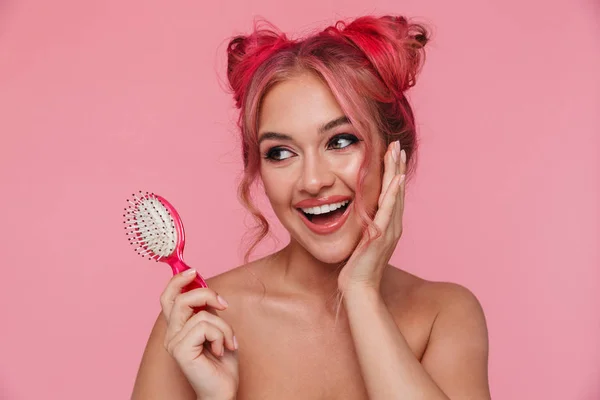 Portrait of shirtless young woman smiling and holding hair brush — Stock Photo, Image
