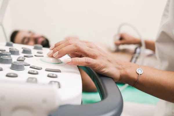 Image of caucasian man getting abdominal ultrasound scan by fema — Stock Image Image of caucasian man getting abdominal ultrasound scan by fema Stock Image