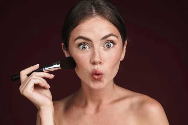 Image of excited half-naked woman using makeup brush — Stock Photo, Image