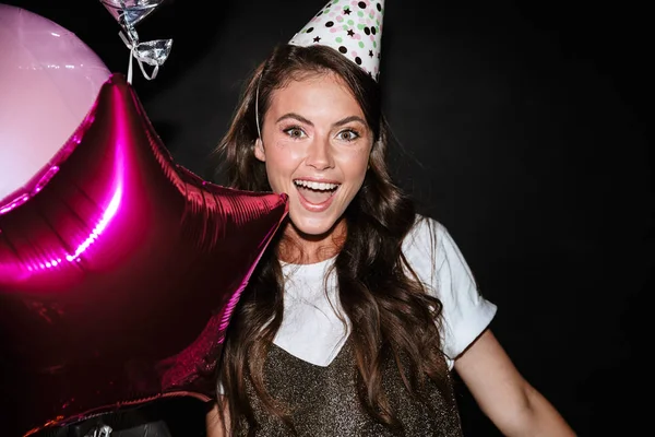 Image of young excited woman holding balloons and smiling — Stock Photo, Image