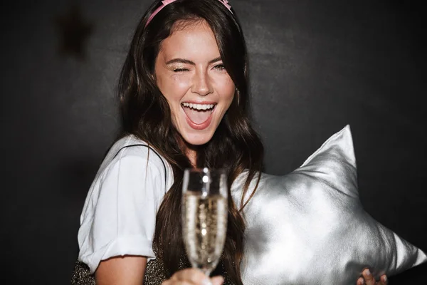 Image of caucasian happy woman holding toy star and glass of champagne while winking — Stock Photo, Image