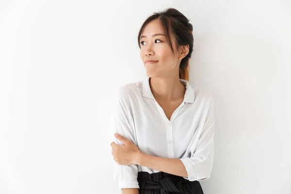 Attractive smiling asian woman standing isolated — Stock Photo, Image