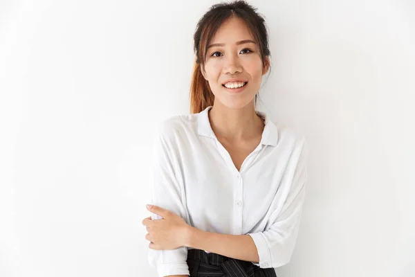 Attractive smiling asian woman standing isolated — Stock Photo, Image