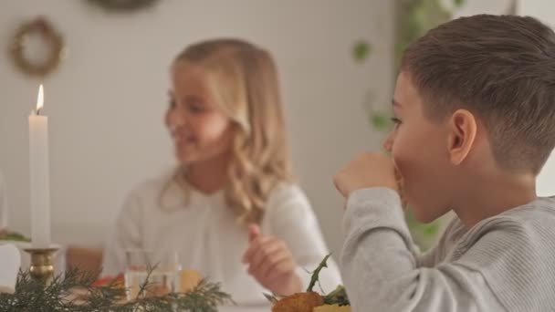 Two Happy Beautiful Children Eating Food While Sitting Table Festive — Stockvideo