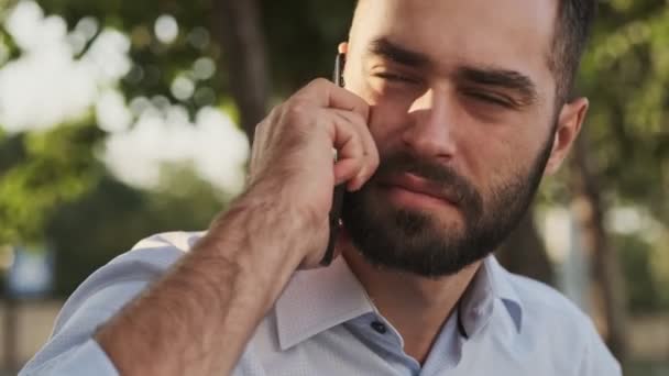 Close View Pleased Bearded Businessman Talking Smartphone Looking While Sitting — 비디오