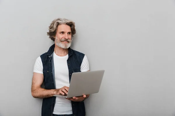 Portrait of a handsome stylish mature man wearing a vest — Stock Photo, Image