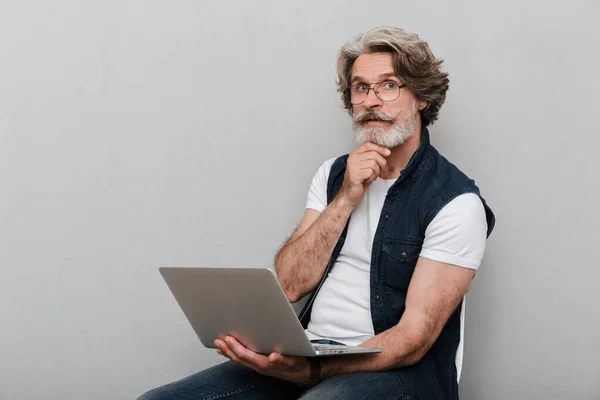 Portrait of a handsome stylish mature man wearing a vest — Stock Photo, Image