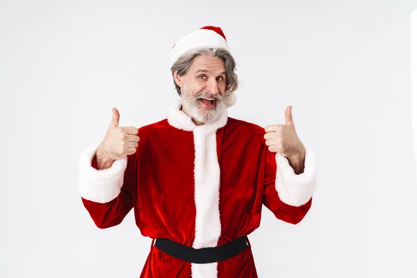Imagen de Papá Noel anciano en traje rojo haciendo gestos con los pulgares hacia arriba —  Fotos de Stock