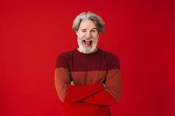 Portrait of amusing old man smiling and winking at camera — Stock Photo, Image