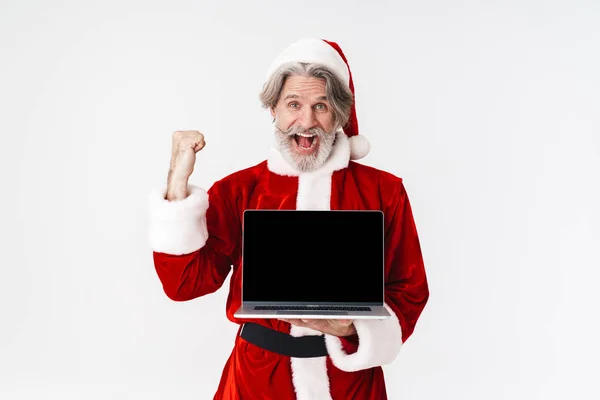 Obraz Santa Claus człowieka w czerwonym stroju gospodarstwa otwarty laptop comp — Zdjęcie stockowe