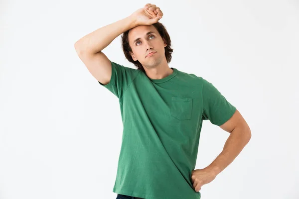 Image of exhausted young man looking upward at copyspace — Stock Photo, Image
