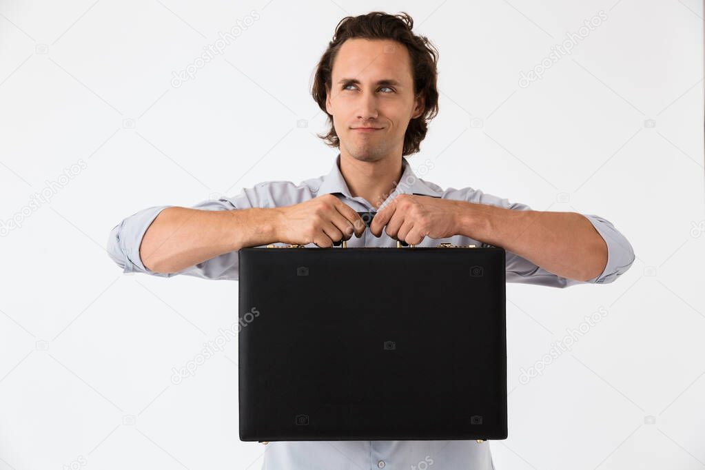 Image closeup of successful businessman holding black briefcase