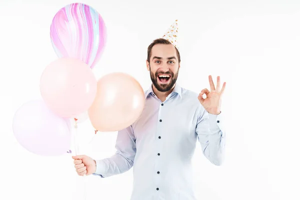 Immagine di uomo partito soddisfatto che tiene palloncini d'aria e gesticolando ok — Foto Stock